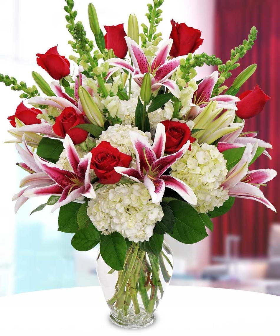 Passionate Love Stargazer Lilies, red roses, white hydrangea in large