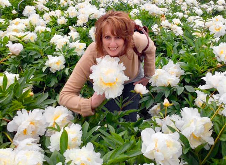 One of our owners sourcing new flowers to make your next bouquet extra-special