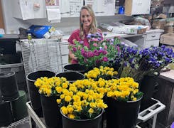 One of Bagoys' owners, Kristin, prepares a new arrangement in our floral design studio